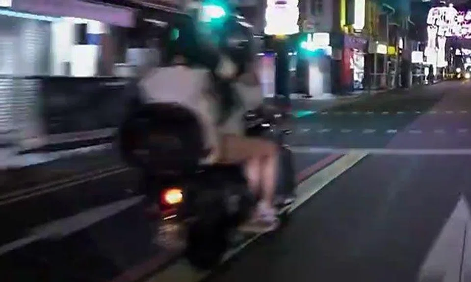 Guy has not 1 but 2 female pillion riders on motorcycle -- and 1 of them isn't even wearing a helmet