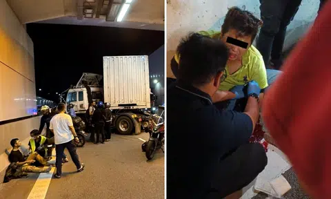 Trailer truck jackknifes in Tuas Checkpoint viaduct, driver arrested after 2 motorcyclists hurt