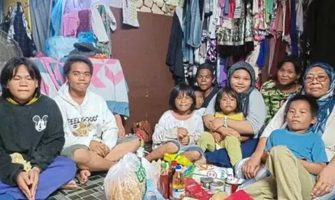 Ms Dayang (right) has been caring for nine grandchildren single-handedly over the past year after her son was jailed for a drug offence.