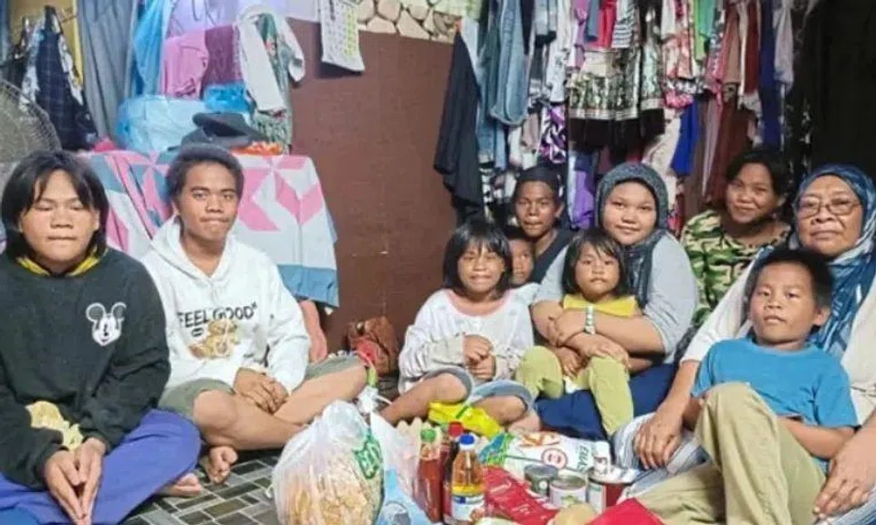 Ms Dayang (right) has been caring for nine grandchildren single-handedly over the past year after her son was jailed for a drug offence.