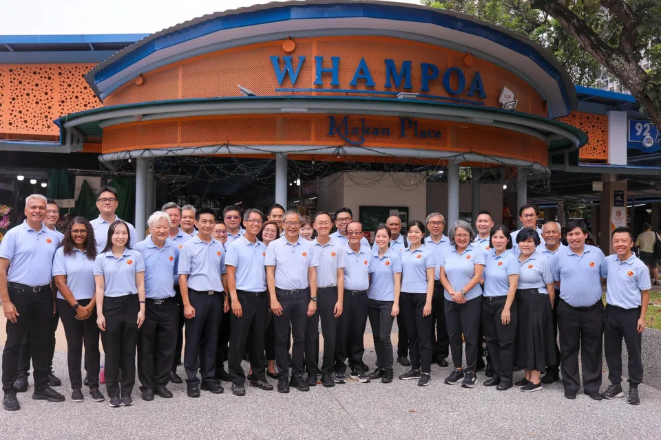Workers’ Party new faces Harpreet Singh Nehal (far left), Kenneth Tiong (second from left) and Jackson Au (fourth from left) with their party colleagues.