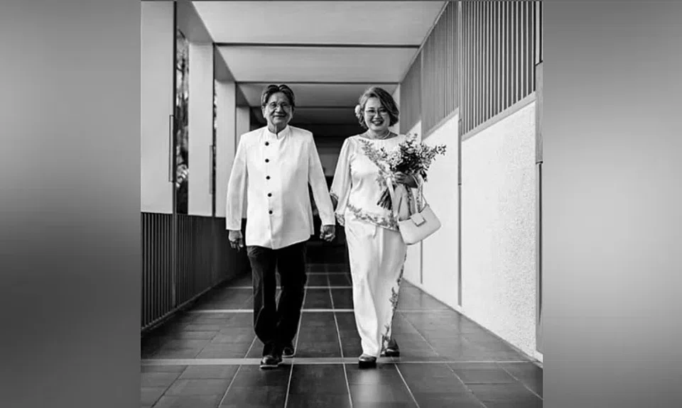Ms Sylvia Lim posted a black and white picture of her and Quah Kim Song walking hand in hand down a corridor at the St Mary of the Angels church.