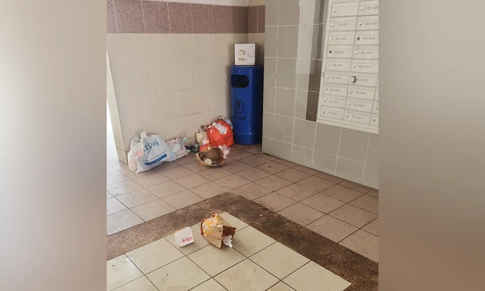 Bags of rubbish were spotted near a bin at a void deck in Tampines