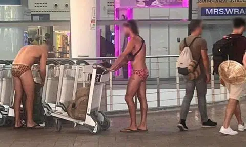 Tourists seen wearing only trunks and slippers at Phuket airport