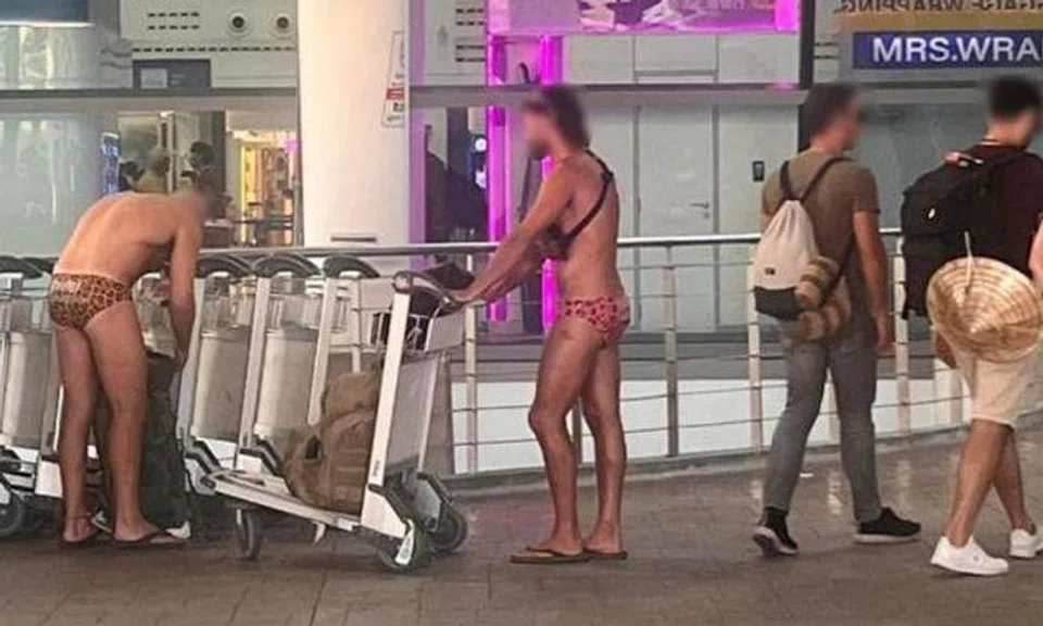 Tourists seen wearing only trunks and slippers at Phuket airport