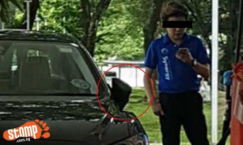 Petrol kiosk attendant fills fuel tank of car -- while using his phone