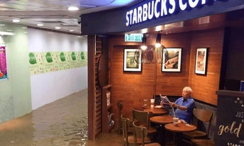 Holy 'frap'! 'Starbucks uncle' sipping coffee during Hong Kong flood goes viral