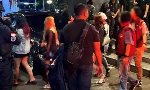 Suspected drug offenders being arrested in a joint anti-drug operation in Batam, Indonesia