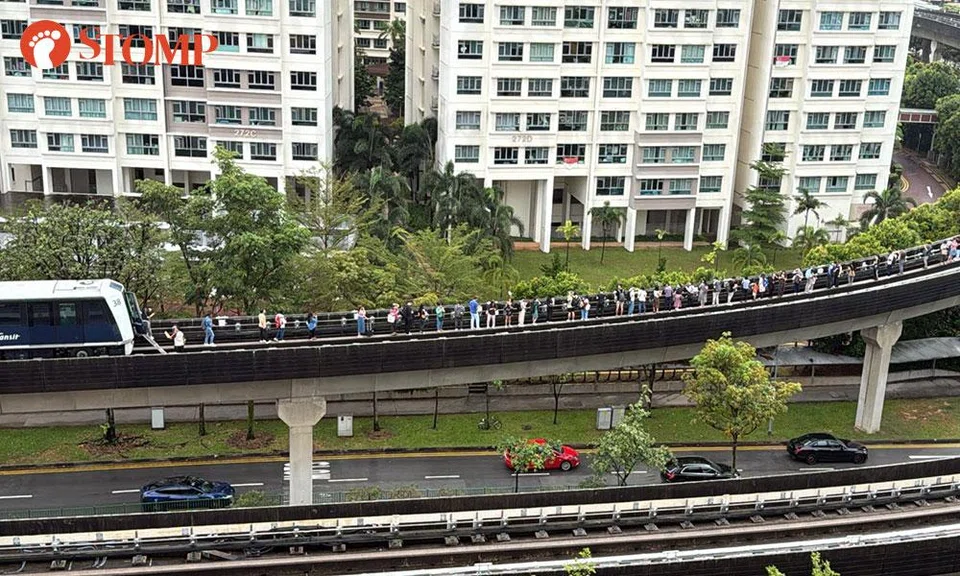 passengers walk on tracks after sengkang punggol lrt line breakdown