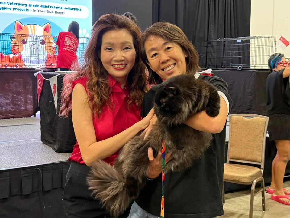 Ms Doris Liam (right) and Zen with Ms Michelle Tay from Feline Club Singapore at The International Cat Association Cat Show.