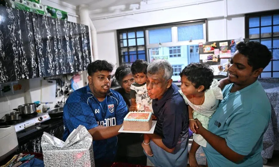 Family celebrating father’s birthday