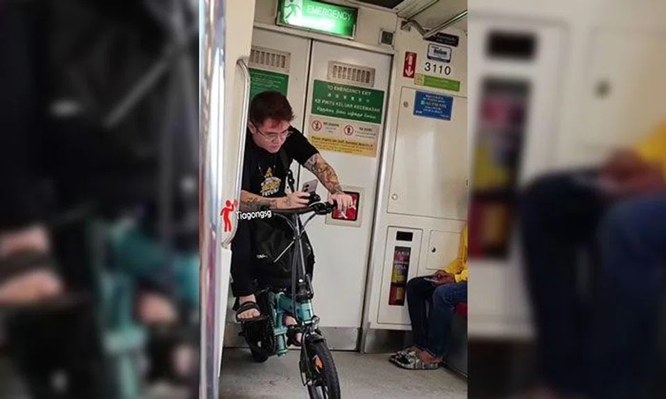 Netizens divided over man sitting on bicycle in MRT train