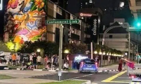 Photos on social media show a ComfortDelGro taxi and a white car near a traffic light at the scene, with a group of pedestrians standing on the pavement. Photo: Seah Yong Kok Francis/Facebook