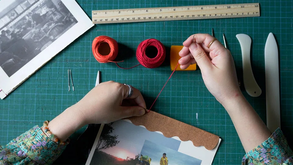 Learn to make a book by hand at Objectifs' book-binding workshop.