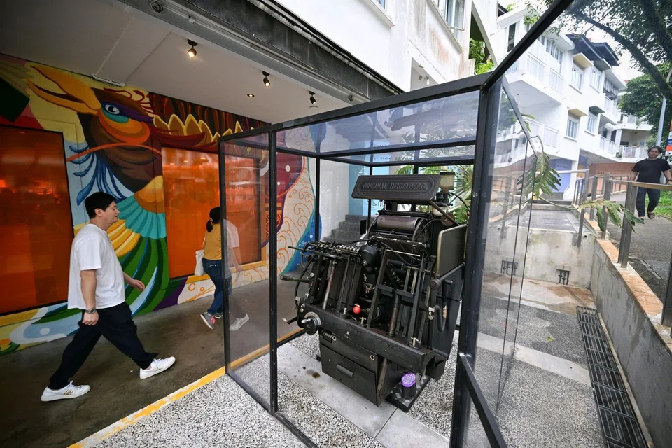 The Heidelberg letterpress outside Bynd Artisan's flagship store in Holland Village. The brand's co-founders made the difficult decision of letting the machine go as the business moved out.