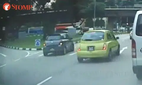 Suzuki driver reverses on main road after missing left turn in Boon Lay