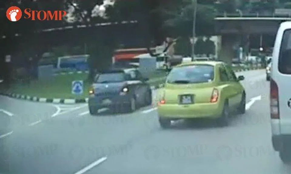 Suzuki driver reverses on main road after missing left turn in Boon Lay