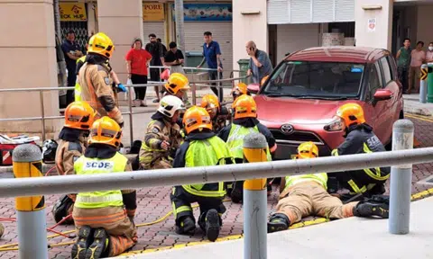 A witness reported that the woman had been hit by the car, before getting stuck underneath it.