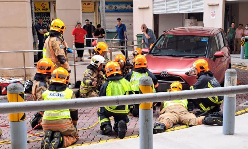 A witness reported that the woman had been hit by the car, before getting stuck underneath it.