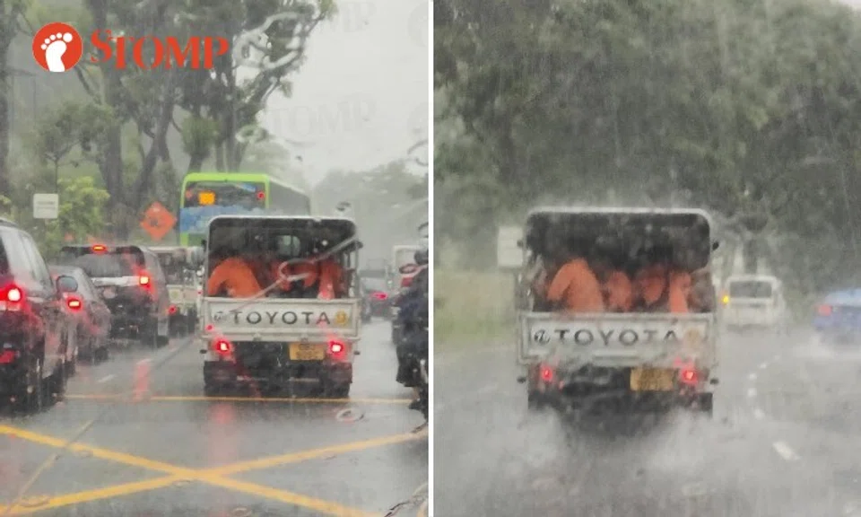 Stomper Isabel shared photos of orange-clad workers huddling in the back of a Toyota lorry on the road during a downpour.