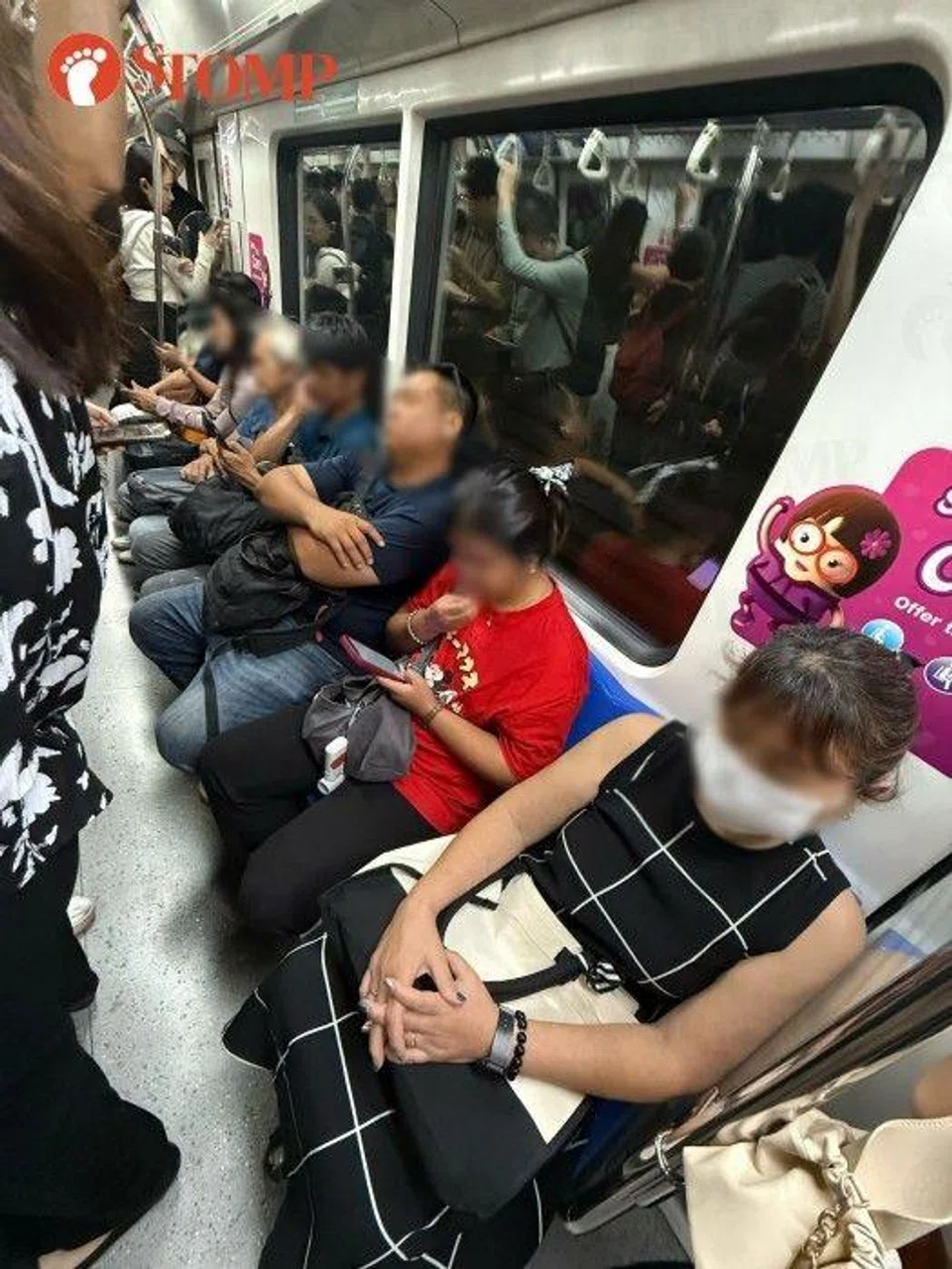 Pregnant woman standing on train