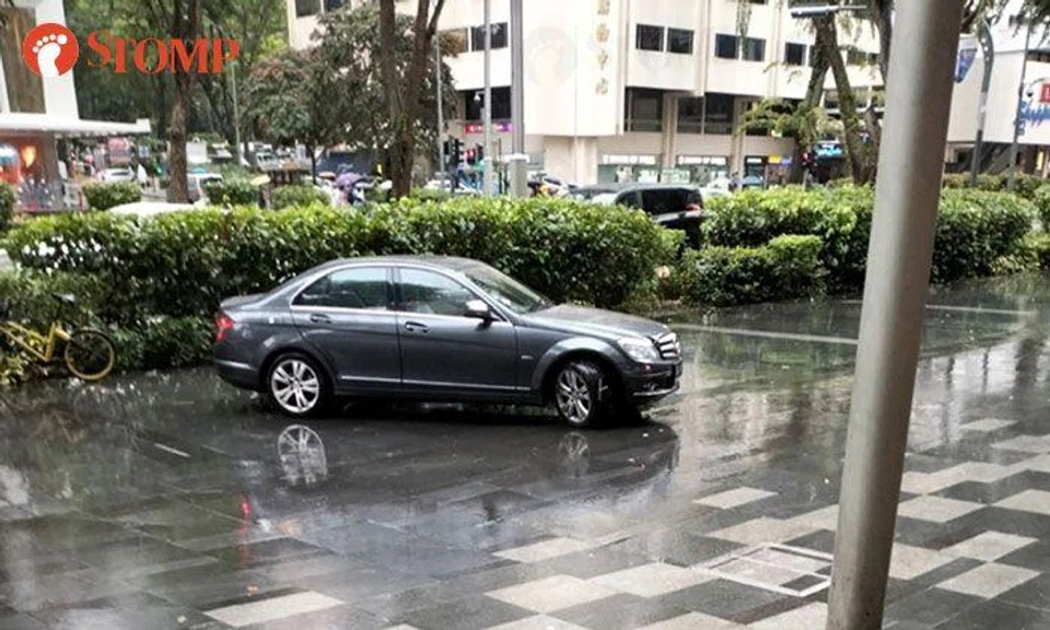 Bad weather or bad driving? Car ends up on walkway outside Shaw Centre