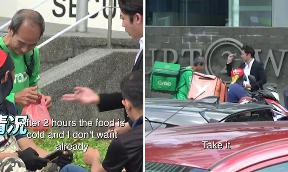 A man was caught on camera throwing cash at a crying GrabFood rider after waiting two hours for the food, which he said had turned cold.