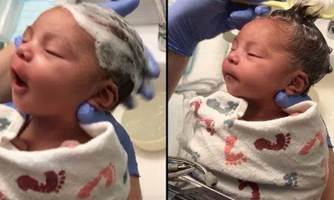 Aww, how cute! Newborn baby gets hair washed