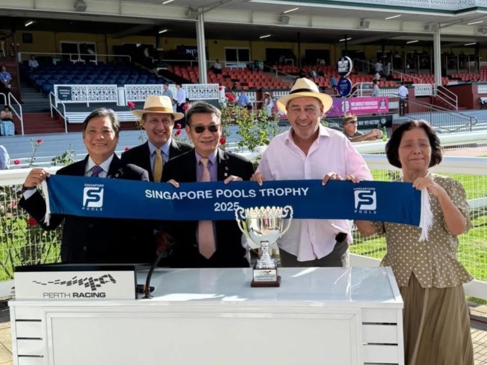 Part-owner Gary Wright (in pink shirt), celebrating his horse West Star's win in the Singapore Pools Trophy 2025 Handicap with (from left) Singapore Pools' chief product officer Simon Leong, Perth Racing chief executive officer James Oldring, Pools' board member Lee Kwok Cheong and his wife Sachiko Tamamura at Ascot Racecourse on April 5.
