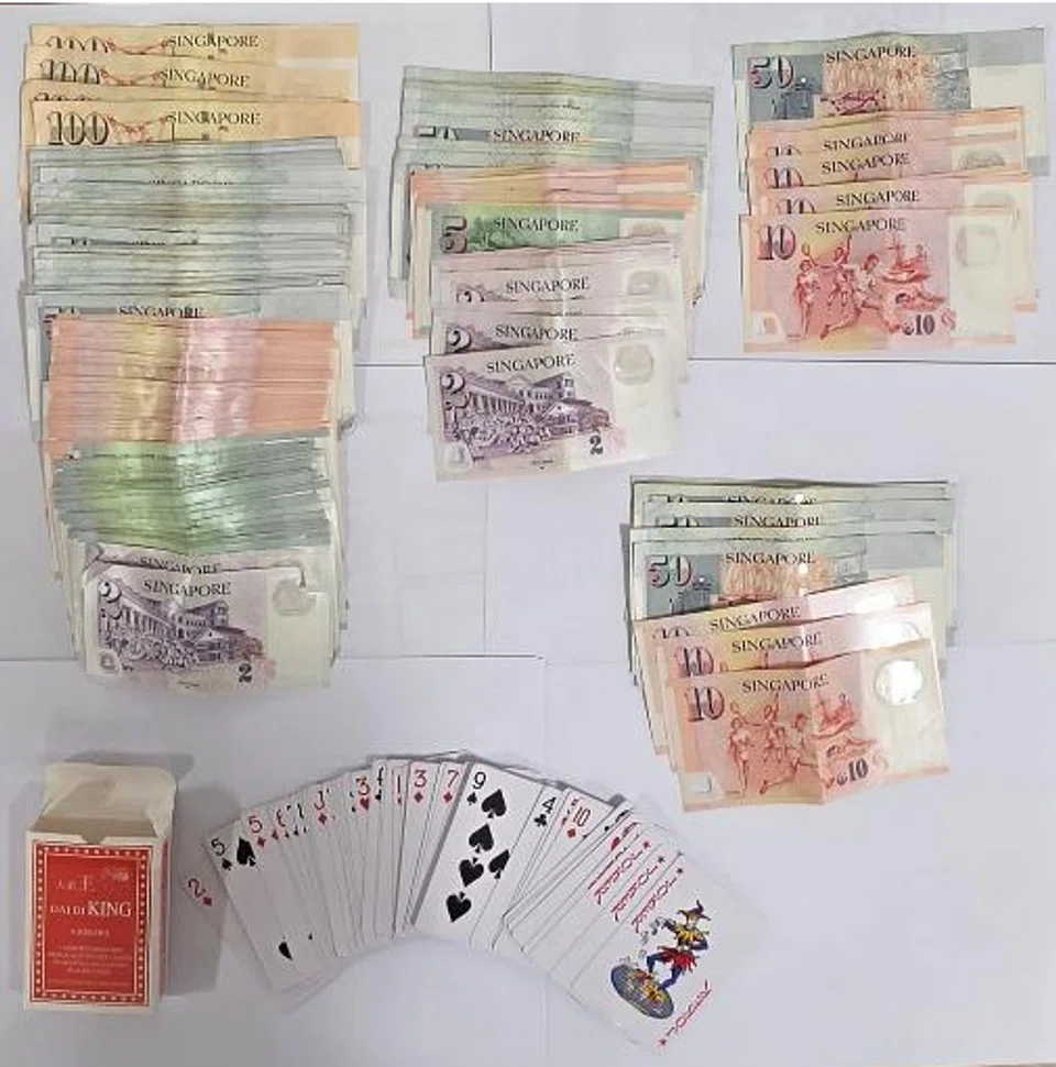 Cash and gambling-related paraphernalia seized during an anti-gambling operation in the vicinity of Yishun Street 61.