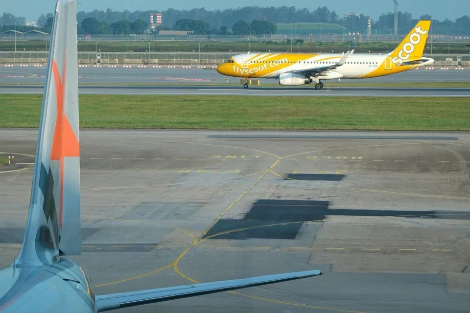 Generic pix of planes at Changi Airport, shot from Budget Terminal 4. A Scoot plane departing Changi Airport Terminal 4. Can be used with stories on Changi Airport, planes, budget airlines, Scoot, budget terminal, T4, low cost carriers