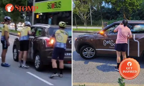 Cyclists riding for charity stop to help stranded GetGo car user out of petrol at Mandai Avenue