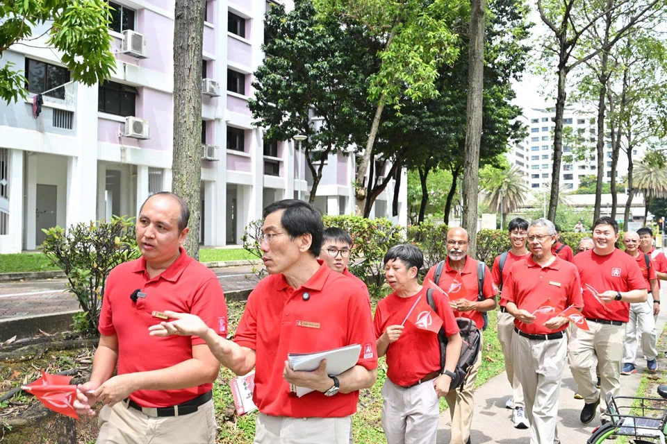 Singapore Democratic Party chief Chee Soo Juan (foreground, right) and party vice-chairman Bryan Lim leading a walkabout.