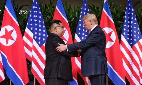 Donald Trump and Kim Jong Un share historic handshake at Sentosa