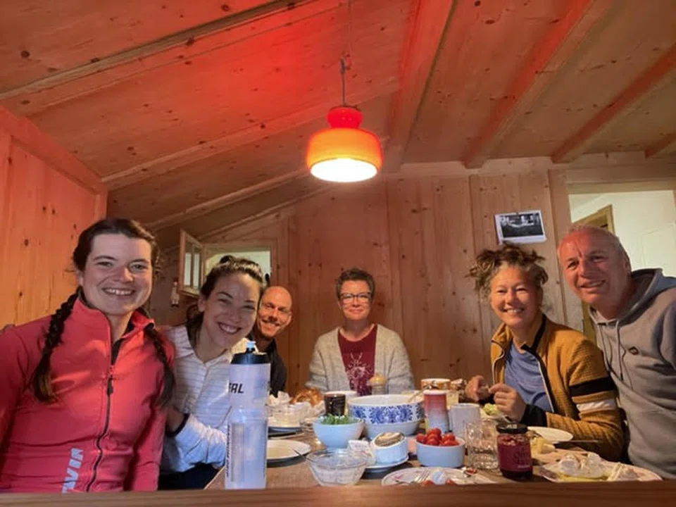 Ms Hotston Moore (in red jacket) with the Swiss couple (second and third from left) who had invited her into their cabin, along with the couple's friends.