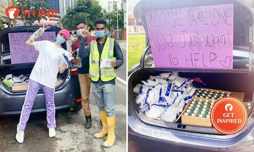 Woman gives out necessities to migrant workers by visiting construction sites island-wide