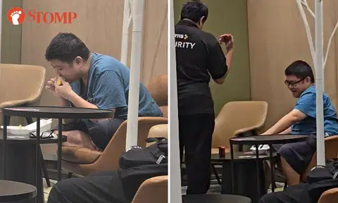Barefoot man eats durian inside Choa Chu Kang library, 'does not care' when confronted by security