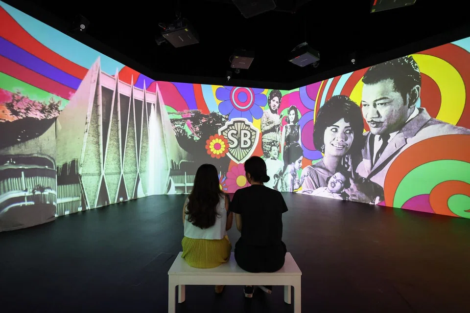 A glimpse into the Screening Room at the SingaPop! 60 Years of Singapore Pop Culture exhibition, where excerpts from local television productions, films and other nostalgic buildings from Singapore's past are showcased.