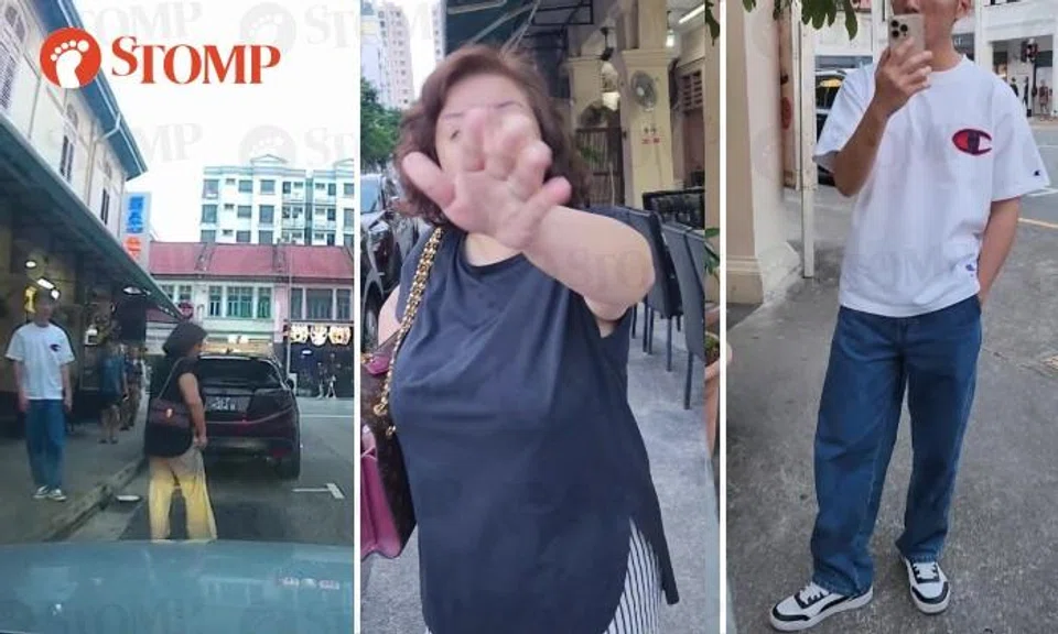 Woman confronted by motorist for standing in parking lot to chope it, tells son to call police