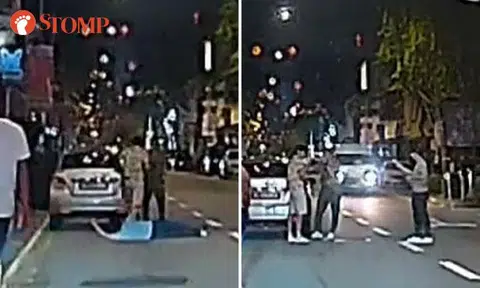 Man lies down then stands in middle of road at Joo Chiat, forcing vehicles to swerve around him