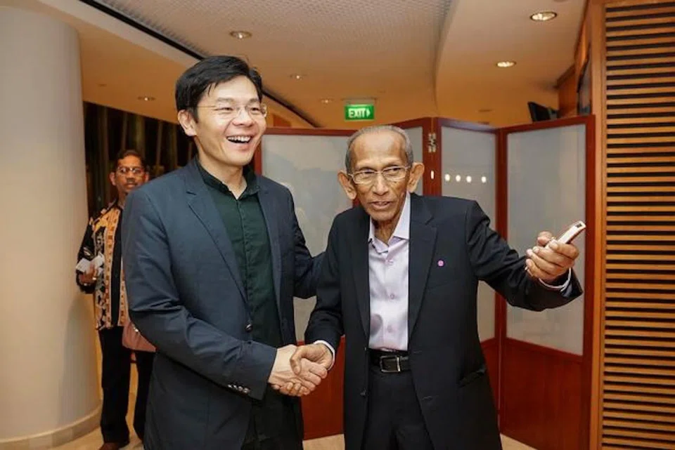 Prime Minister Lawrence Wong with Yusnor Ef in 2014.