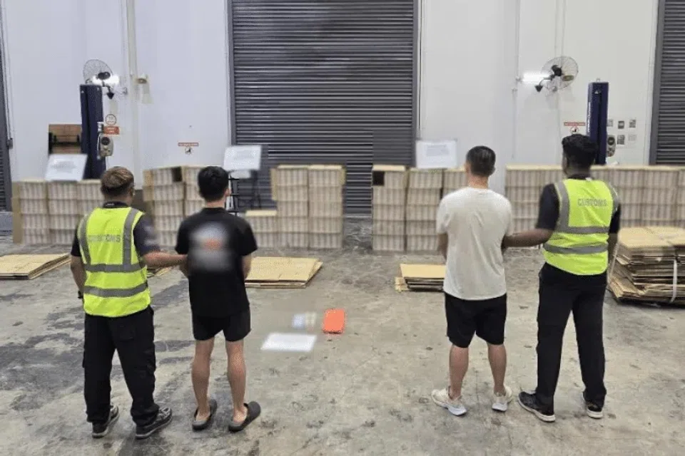 Two of the men arrested following enforcement operations by Singapore Customs on May 9 and 10.