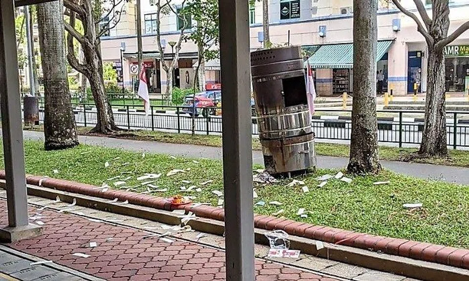 A Facebook user posted a picture of the scene at a grass patch in Tampines. It showed a mess of joss paper scattered around the designated burner.