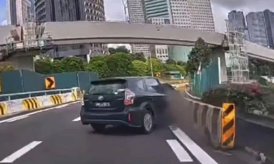 Woman taken to hospital after car crashes into barrier, PHV driver assisting with investigations