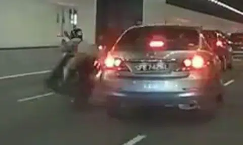 Driver who knocks motorcyclist off his bike turns his back on victim -- but kudos to motorists who stopped to help