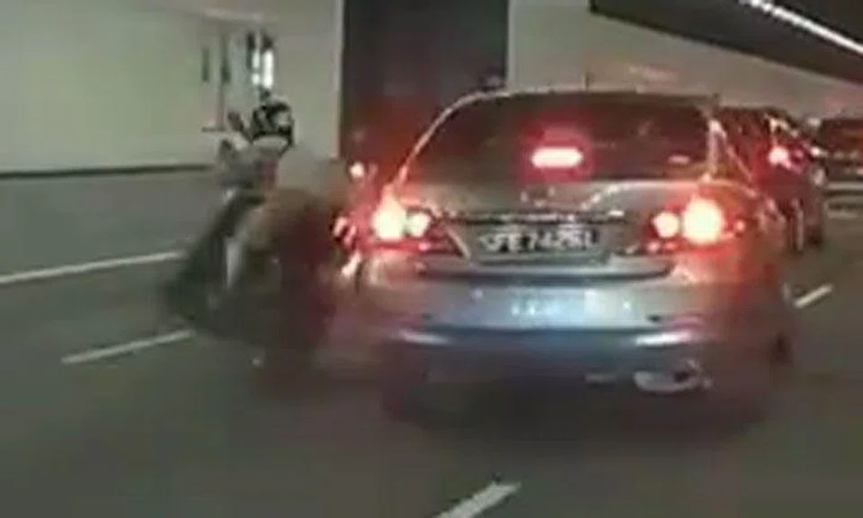 Driver who knocks motorcyclist off his bike turns his back on victim -- but kudos to motorists who stopped to help