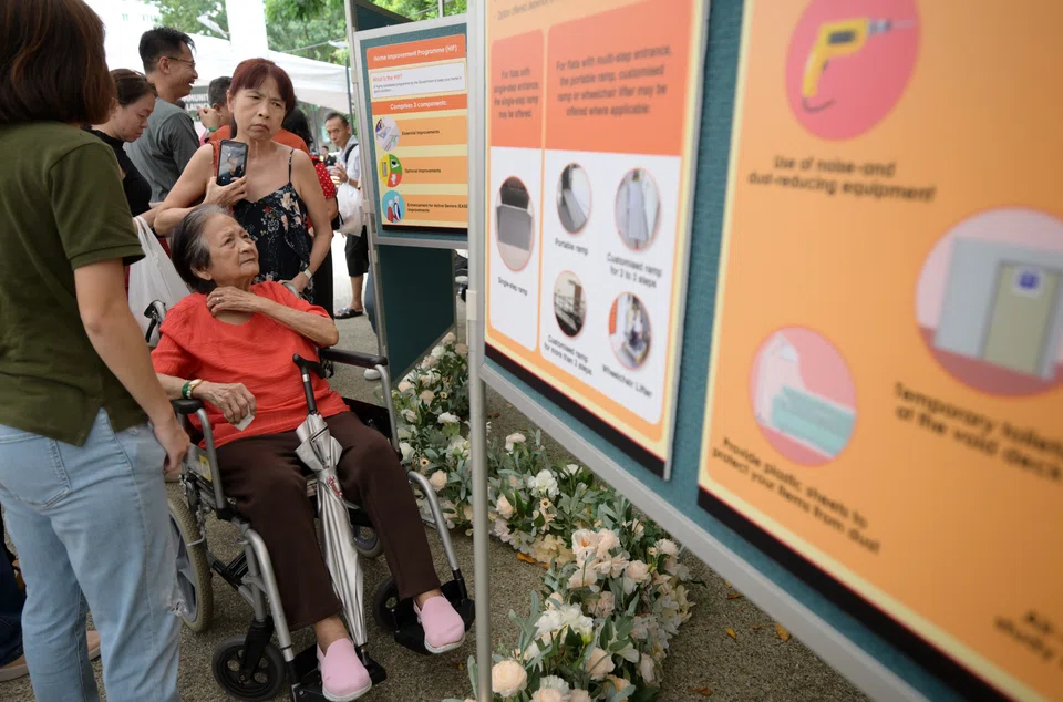 Residents looking at information on the HIP programme in Jurong West on Feb 16.