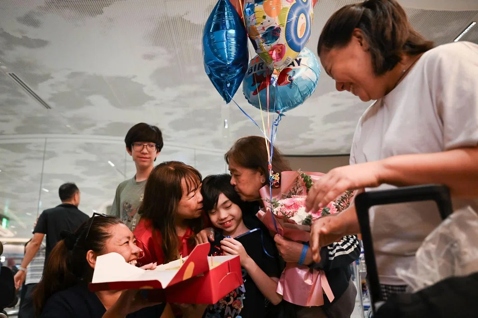 Arman Nurakhmetov having his birthday celebrated belatedly by his family members upon his return to Singapore on March 11. ST PHOTO: SHINTARO TAY
