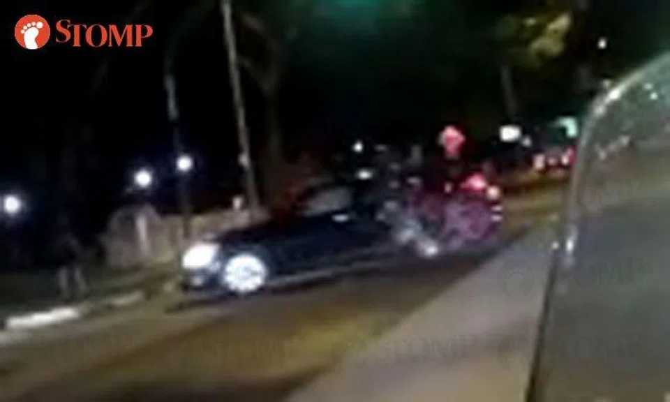 Biker sent flying after hitting car making right turn