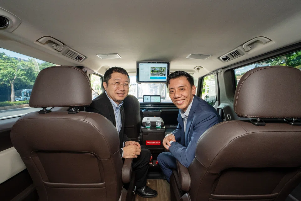 Acting Transport Minister Jeffrey Siow (right) and WeRide chief executive Tony Han in an autonomous taxi in Guangzhou on June 27.